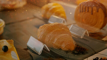 Almond croissants from a bakery specializing in puff pastry croissants, offer an Italian or French breakfast concept.