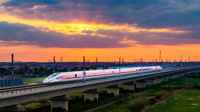 High-Speed Train CR450 on Railroad Bridge at Sunset, Shanghai