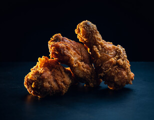 fried chicken in black background