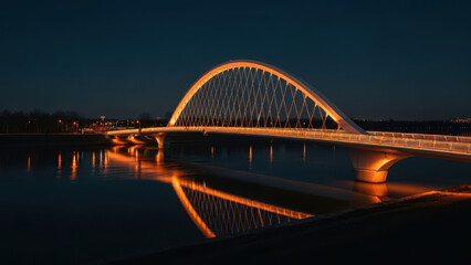 Obraz premium Illuminated Bridge Over Calm River at Night