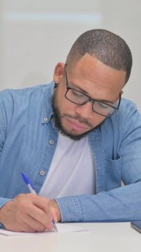 Mixed Race Man Writing a Letter, vertical video