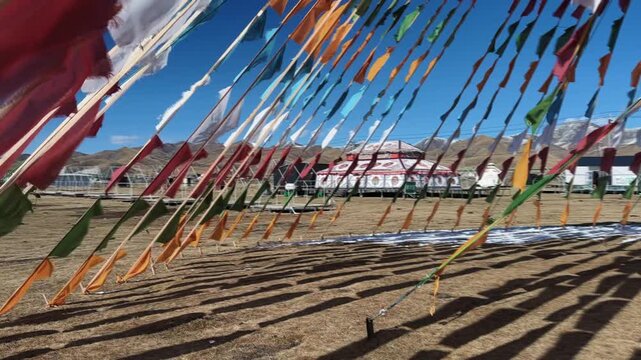 Tibetan Prayer Flags (Lungta) At Qilian Mountains Near Xining, Qinghai, China. Handheld, Tracking Shot