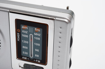 Portable battery-powered AM/FM radio photographed against a white background.