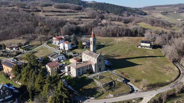 Aerial view of Santi Salvatore e Gallo church and village in Morfasso, Italy
