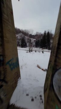 Fast vertical fpv racing run through dark interior levels of abandoned factory complex, Belgo factory Shawinigan Montreal Canada