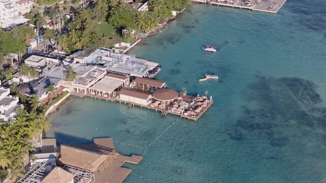 Aerial top down of Neptuno&rsquo;s Restaurant in Boca Chica, Dominican Republic. Clear turquoise ocean water of Caribbean sea in summer.
