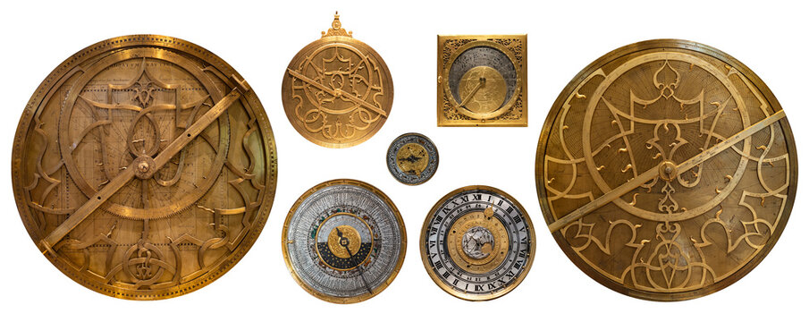 Collection of antique astrolabes and historical astronomical instruments isolated on white background. Armillary sphere, quadrant, planisphere, sundial, astronomical clock dials.