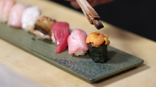 Chef Brushing Soy Sauce on Uni Gunkan Sushi During Omakase Course