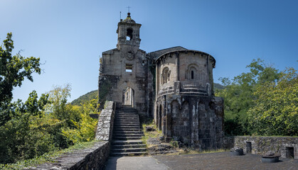Ancient Stone Chapel Amidst Lush Greenery
