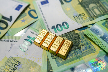 Euro banknotes with gold bars, investment, financial growth, fortune and wealth concept