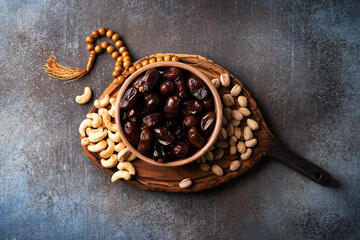 Ramadan Kareem background with dates, cashews and pistachios