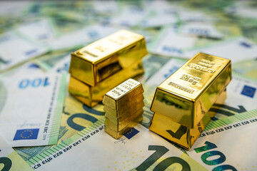 Golden bars on euro bills illustrating luxury wealth, investment opportunity and financial stability