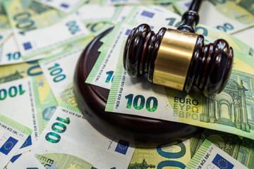 Judge gavel with 100 euro bills symbol of law and justice system