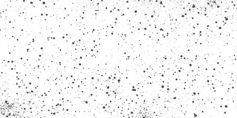 Obraz premium Black ink splatters and dots on a white background abstract texture