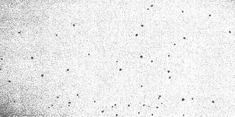 Obraz premium Black dots scattered on a textured grey background with a gradient effect abstract