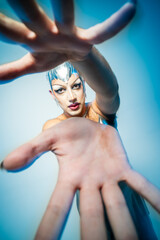 Captivating Portrait of a Latin Drag Queen Reaching out With Expressive Hands