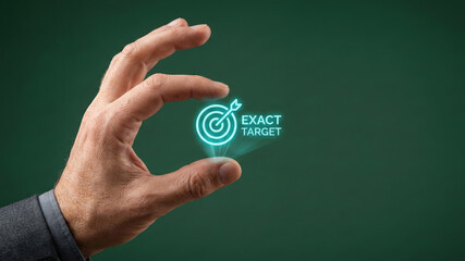 Business concept high level planning target marketing icon glowing in hand close up on green background