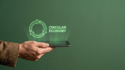 Business high level planning concept circular economy icon hologram over mobile phone screen on green background