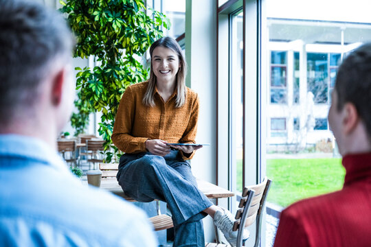 Business team discussing ideas in a modern coworking office
