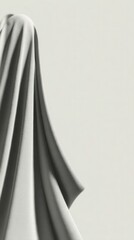 White fabric creating soft folds and shadows on a minimalist background