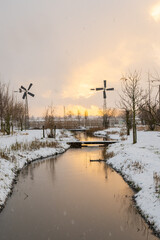 Sun sets on snow in Westergouwe as winter storm system brings unusually heavy snowfall in the Netherlands. Code Orange weather warning is in effect