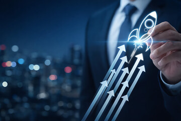 Businessman drawing rocket ship taking off from rising arrows graph representing startup launch and boost