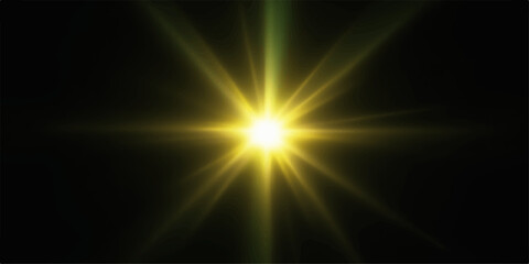 Fototapeta premium Bright yellow starburst light on black background