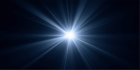 Bright light shining with rays on dark background