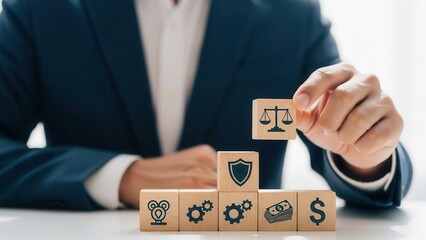 Businessman building blocks with law, security, and finance symbols business lawyer law