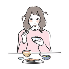 朝ごはんを食べる可愛い女性　和食