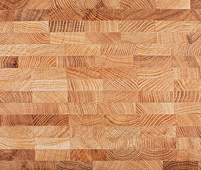 Oak wooden board as background, top view. Natural durable end grain hardwood cutting board.