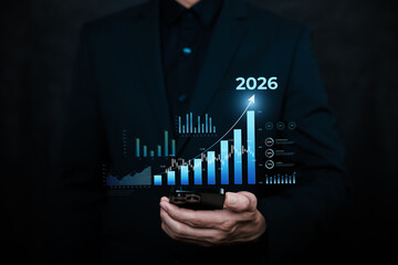 2025-2026 concept.Business analytics and performance growth concept with professional hand interacting with virtual bar chart and data dashboard on laptop, representing metrics analysis, strategic pla