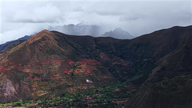 Pumahuanca Ancopacha Mount Patacancha farmland Sacred Valley Maras Salt Mine Peru Per&uacute; aerial drone Urubamba Ollantaytambo rainy season cloudy Peruvian Andes Moray Chic&oacute;n Cusco region circle right