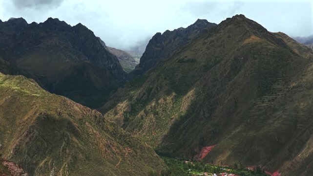Peruvian Andes canyon Mount Patacancha Cuncani Pumahuanca glacier Sacred Valley Chic&oacute;n Peru Per&uacute; aerial drone rainy season rain clouds Quelccaya Urubamba range cusco region parallax circle right