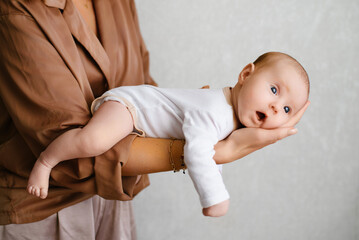 Adorable Newborn Resting On Mother Hand