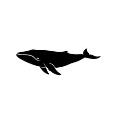 Obraz premium A striking black silhouette of a majestic whale swimming gracefully in the ocean.