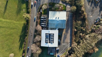Aerial drone view of state of the art data center, AI and quantum cloud storage IT infrastructure, cooling fans and turbines. Sunny day near Redditch, United Kingdom.
