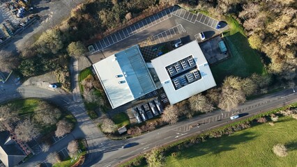 Aerial drone view of state of the art data center, AI and quantum cloud storage IT infrastructure, cooling fans and turbines. Sunny day near Redditch, United Kingdom.