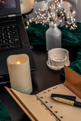 Cozy workspace with to-do list, coffee and candles &ndash; planning and mindfulness concept