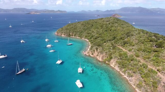 Drone shot of Tortola coast with yachts moored in blue water