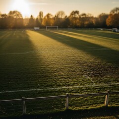 Golden Hour on the Soccer Field - A Serene Morning Scene.