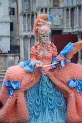 the woman in a period costume with bright colors