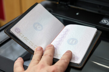 Copying Passport Pages Document Copy Center &ndash; Office Administrative Service. A man's hand holds a document.