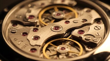 Mechanical Watch Movement Oscillating Balance Wheel in Close-up with Warm Lighting