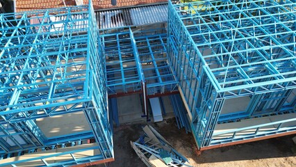 Steel frame house under construction, modern residential building site