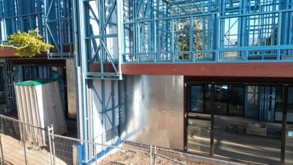 Steel frame house under construction, modern residential building site