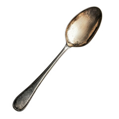 A single silver spoon is placed on a flat surface with natural light shining on it, highlighting its details
