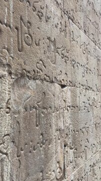 Ancient Georgian Script Inscription Carved on Stone Wall, Medieval MKHEDRULI Alphabet, Ananuri Fortress, Georgia