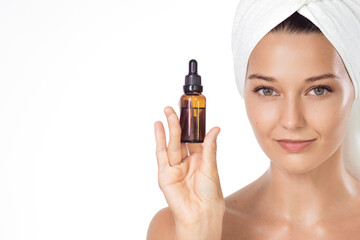 Beautiful Woman in White Towel Turban Holding Serum Dropper Bottle
