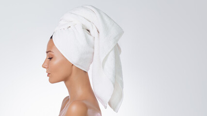 Side-Profile Beauty Shot Of Towel-Wrapped Woman On White Background